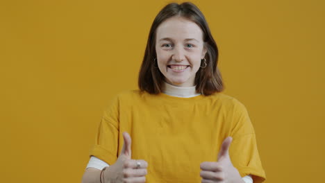 young woman giving a thumbs up