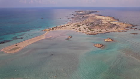 aerial view of a tranquil island during a sunny day in coastal waters