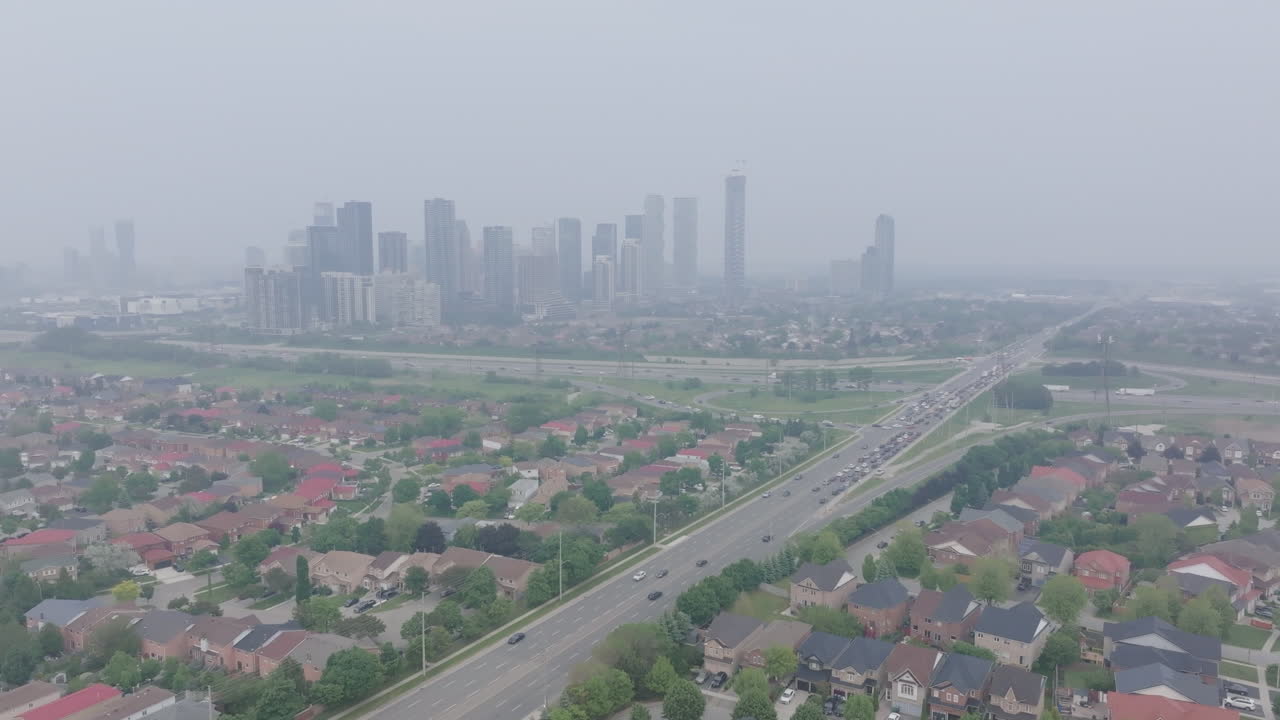 Mississauga with wildfire smoke and poor air quality over toronto area, aerial view