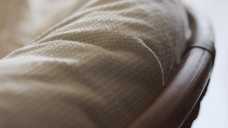 cushion fabric cover of a rattan chair inside the house