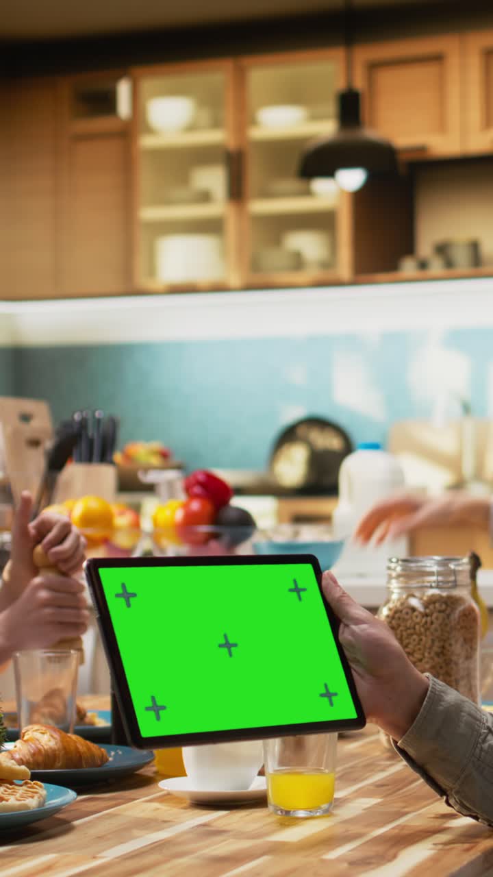 Vertical Video Mockup screen on tablet with father gathered for breakfast with his family
