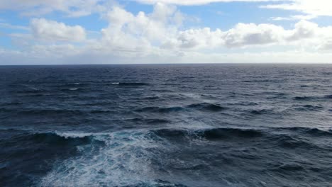 Drone-majestically-gliding-in-front-of-ocean-waves-in-Hawaii