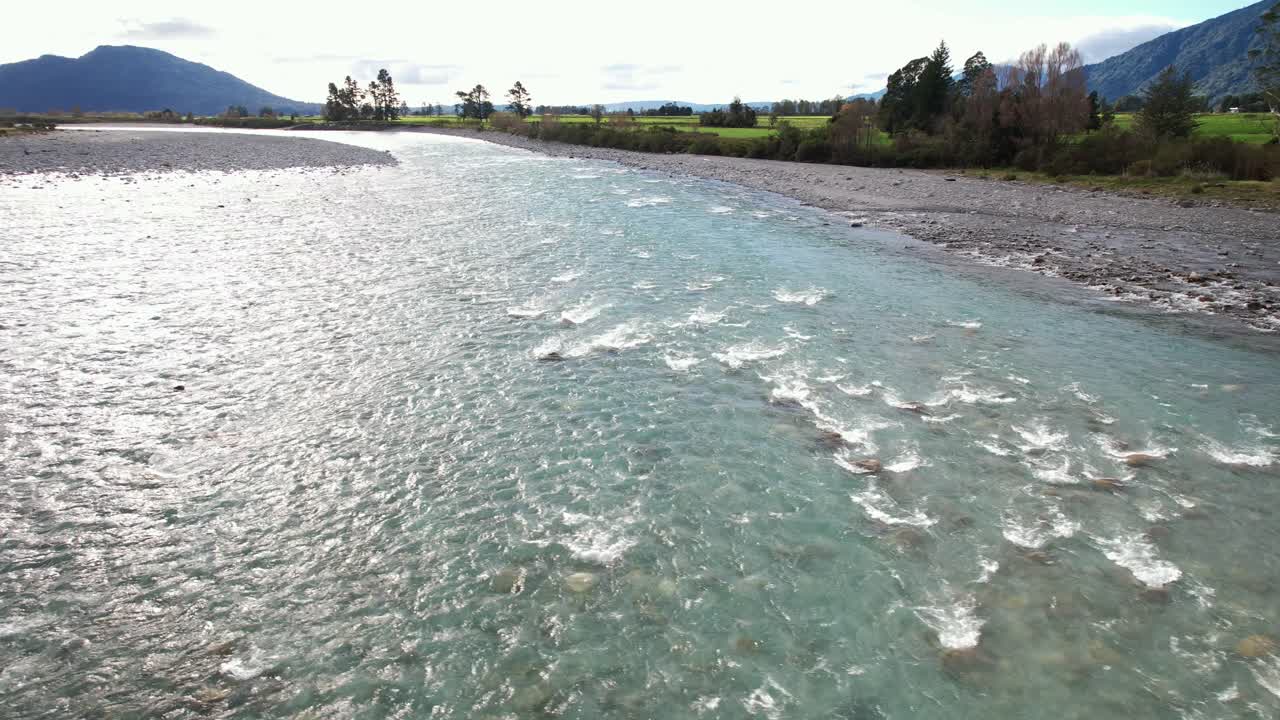 Shallow Water Flowing Through The Hokitika River In Daytime In South Island, New Zealand. - aerial shot
