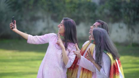 Indian-friends-clicking-pictures-in-a-Holi-festival