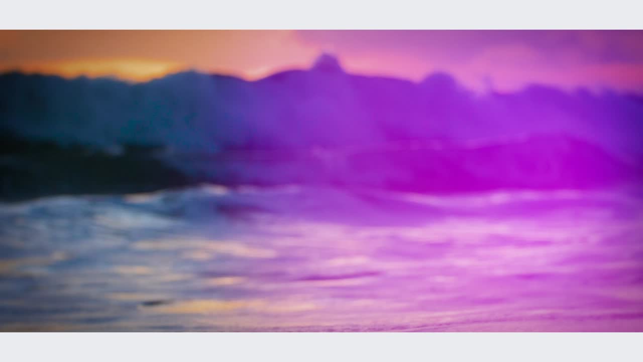 Sunset over the ocean with dramatic clouds and waves