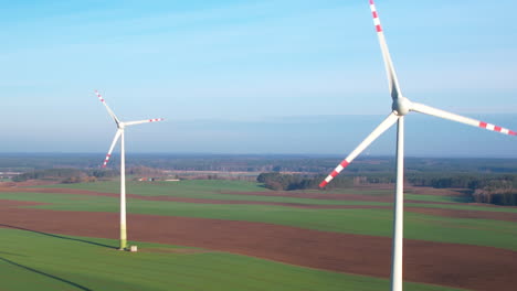 aerial panorama view of rural scenery with two windmills producing alternative energy