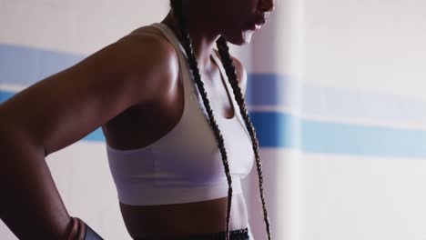 mixed race woman in boxing gym