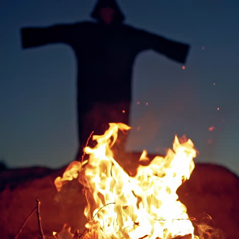 evil witch conjures in the wizarding lair. scary halloween concept. burning fire.