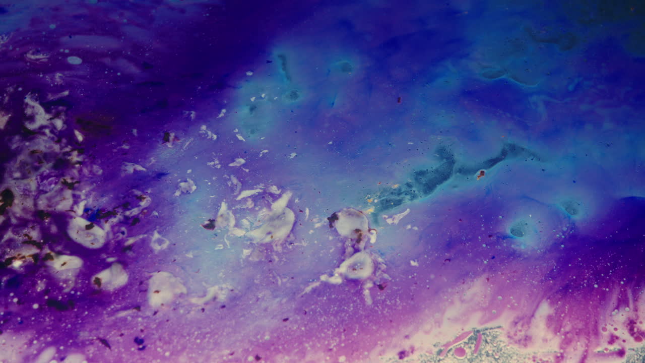 Colourful, organic, liquids macro shots buzzing and flowing