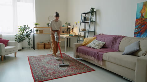 woman cleaning home with cordless vacuum