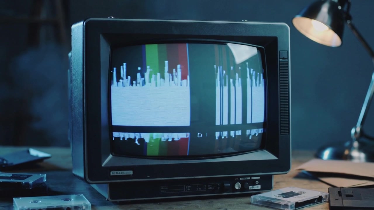 Receiving signal, CRT TV displaying rising histogram and vertical bars on worn table with desk lamp