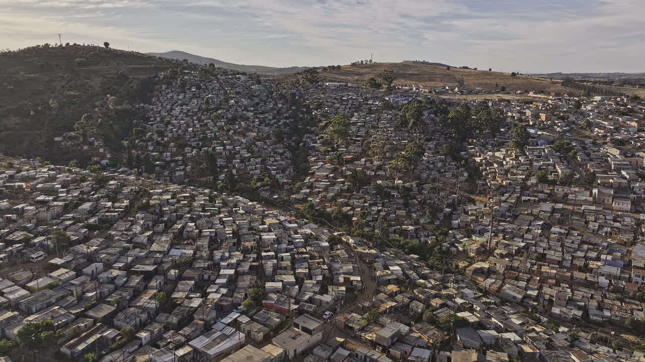 Stellenbosch South Africa Aerial v20 flyover Kayamandi township capturing slums on hilly terrain, Cloetesville residential neighborhood and mountain views - Shot with Mavic 3 Pro Cine - Jan 6th 2024