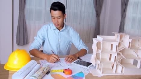 young architect man unhappy man with an architectural project