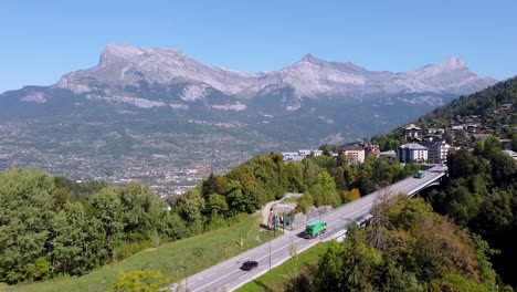 flying backwards over a bridge, nice mountain range in the background