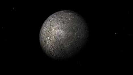 rhea, la luna de saturno, girando en su propia órbita en el espacio exterior.