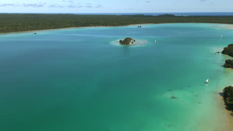 Aerial-parallax-over-Upi-Bay,-Isle-of-Pines