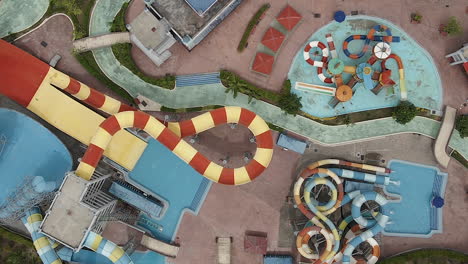 Low-flyover:-Colourful-fun-slides-at-waterpark-in-Langkawi,-Malaysia