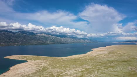 Panorama-Of-Croatian-Island-Under-White-Clouds-Across-Adriatic-Sea-From-Pag-Bridge-In-Croatia