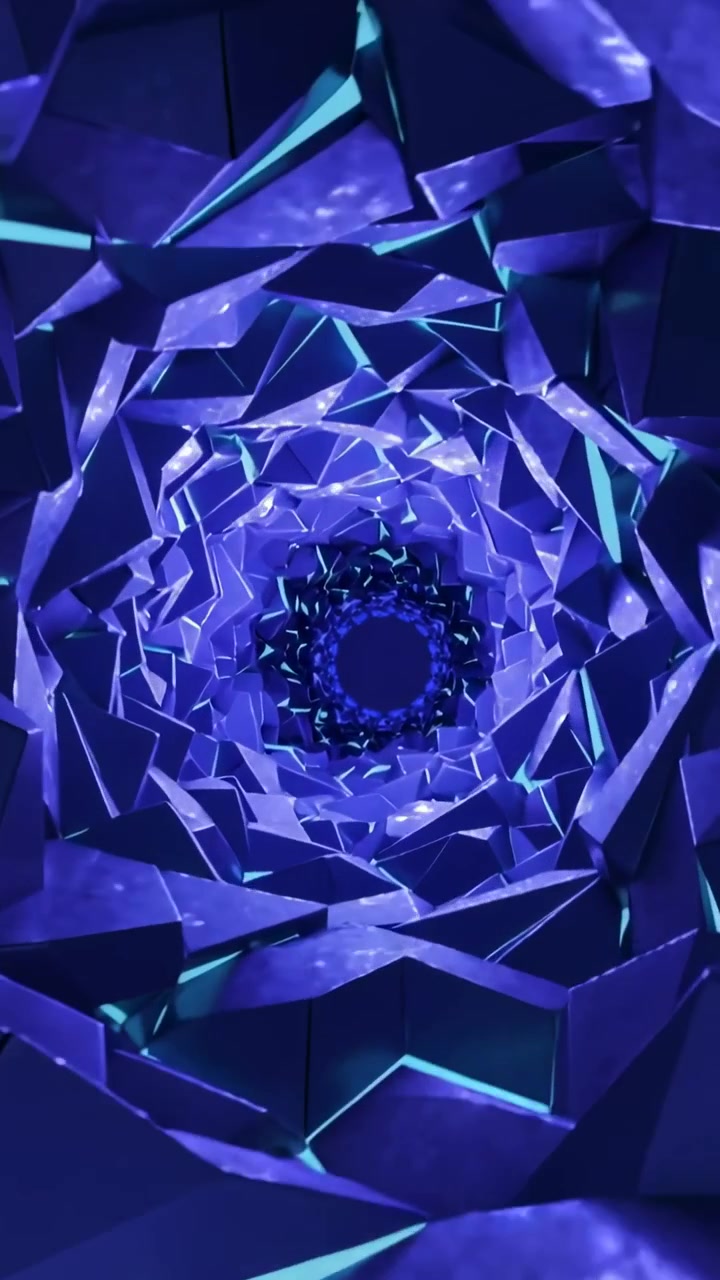 Video verticale: Sfaccettature a spirale che ruotano verso l'interno nel vuoto, rivelando giunture ciano e il nucleo.