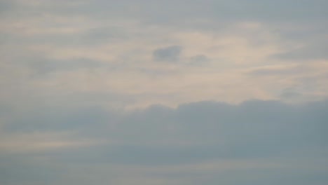 Lone-Bird-Flying-Against-Cloudy-Sunset-Sky.-wide