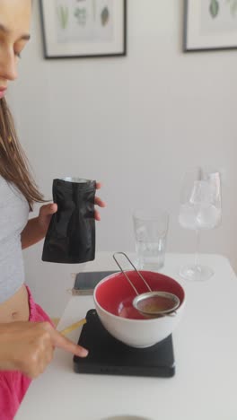 young woman preparing matcha tea
