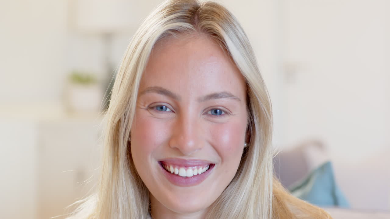 Decorating home for festive holiday season, woman smiling and arranging decorations
