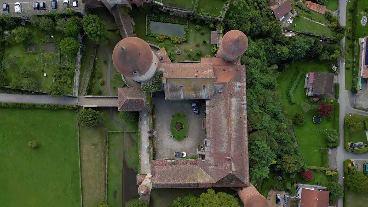 Bird's eye view drone shot of Chenaux Castle in Estavayer-le-Lac in Canton of Fribourg Switzerland