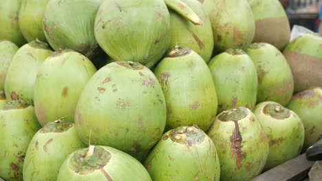 Stack-of-fresh-coconut-display-for-sale