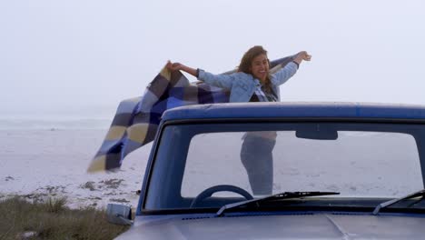 Woman-with-scarf-having-fun-on-the-car-4k