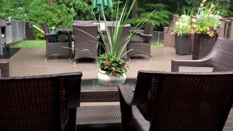 Rain-lightly-pattering-on-a-suburban-deck-during-a-summer-storm-with-a-warm-look