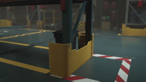 close-up of a yellow safety barrier in a warehouse