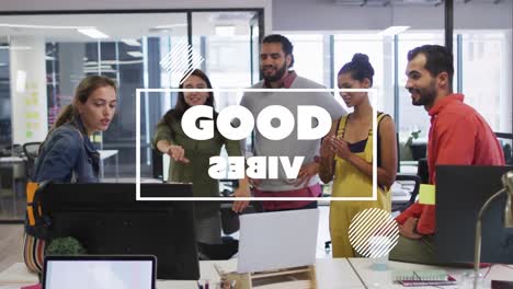 animation of good vibes text over smiling diverse business people using laptop