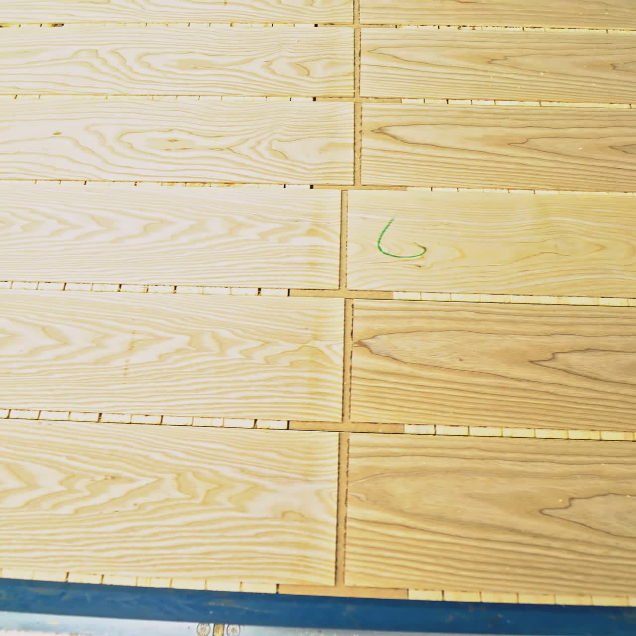 ?lean and smooth boards is going through all the processing steps for getting the final result of parquet for sale on the market. Close-up.