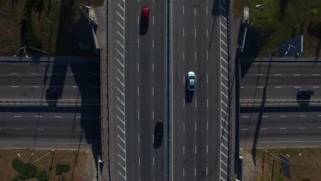 Drone-view-car-driving-on-highway-bridge.-Top-view-car-traffic-on-highway-flyove