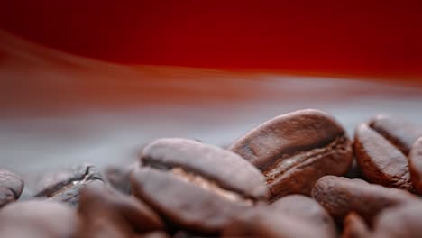 close up of seeds of coffee. fragrant coffee beans are roasted smoke comes from coffee beans.