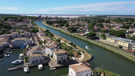 aerial view of the canal du rhone a sete in aigues-mortes with a leisure boat