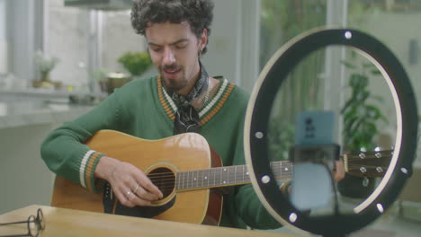 Music Blogger Filming Guitar Class at Home