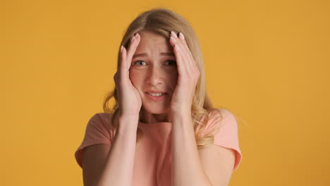 Scared-Caucasian-woman-covering-face-on-camera.