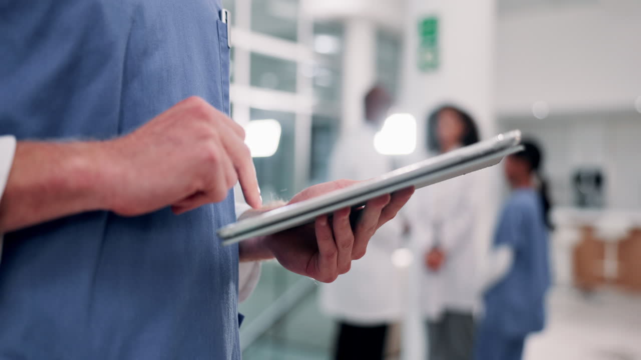 Medical professionals using a tablet