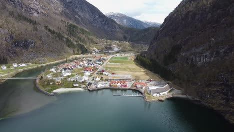 norways richest municipality modalen - aerial approaching town centre from the sea