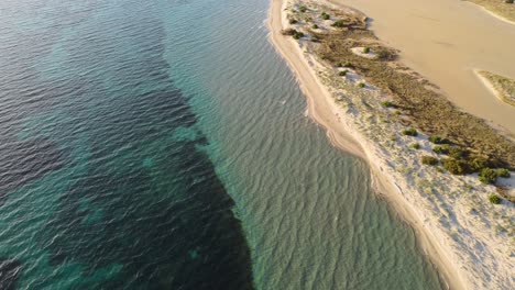 Background-seascape-sand-shoreline-beach-with-paradisiac-water,-Sardinia,-aerial