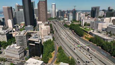 drone shot of cars driving into seattle on the main freeway