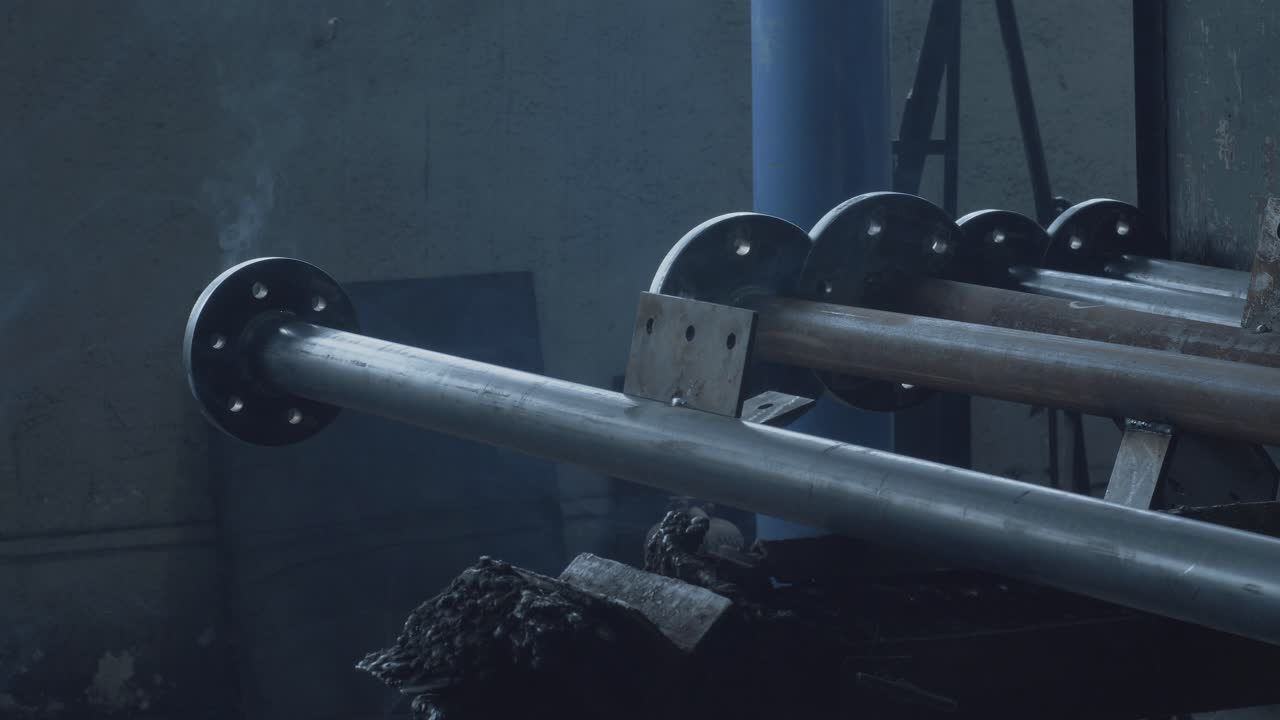 Industrial Metal Pipes and Flanges in a Factory Setting