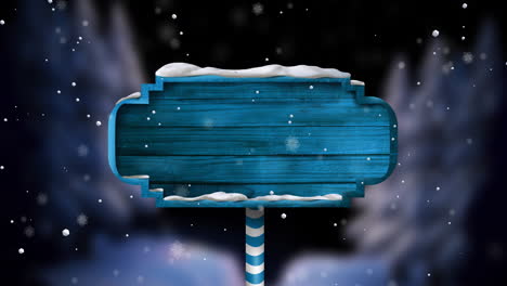 animation of christmas blue sign with copy space and snow falling background