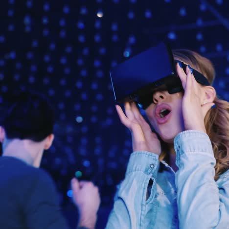 woman in a virtual reality helmet dancing at a disco