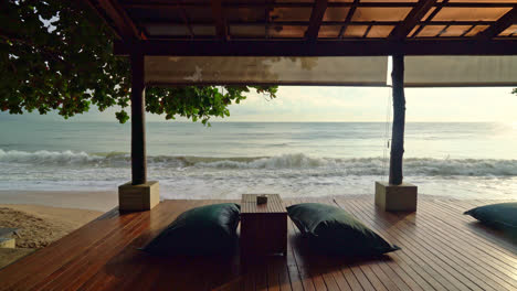 bean bag on balcony with sea beach background at sunrise or sunset time