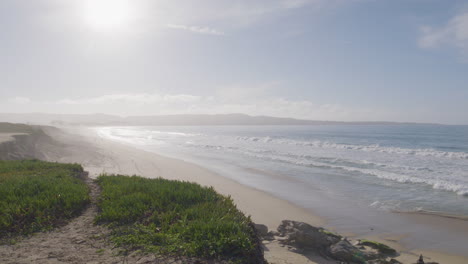 slow motion shot of a deserted beach on a sunny day at marina state beach monterey bay california