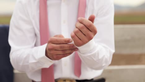 Young-Male-Cowboy-Groom-Adjusts-White-Shirt-Sleeves-While-Getting-Dress-for-Event-1080p-60fps