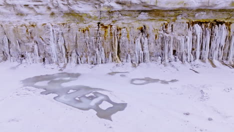 frozen streams of water on the edge of a cliff