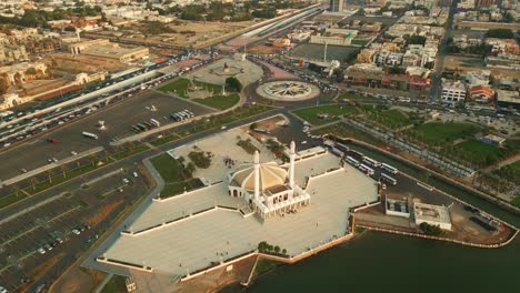 wide aerial view of hassan enany mosque near sea shore at sunset